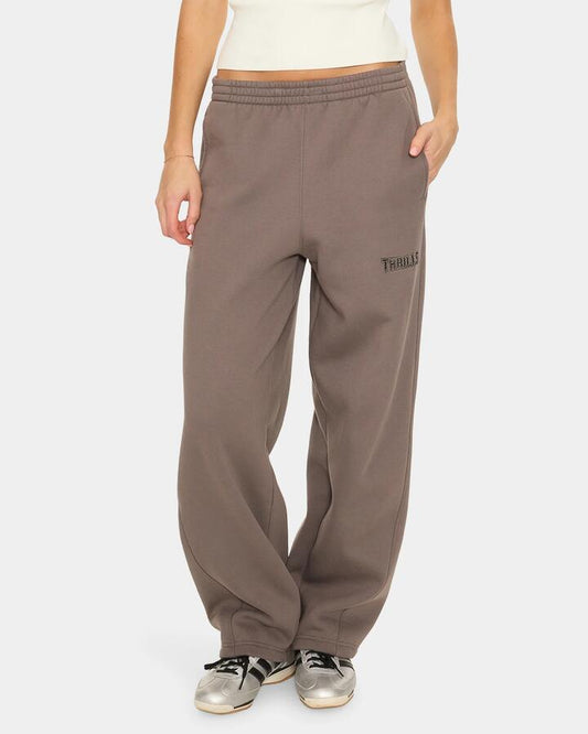 Image of a model wearing Pants. Product name - Thrills Take It Easy Track Pant Clba Clay Smoke in Clay Smoke colour by brand - Thrills