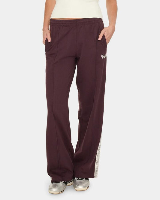 Image of a model wearing Pants. Product name - Thrills Off Track Pant 13A Aubergine in Aubergine colour by brand - Thrills