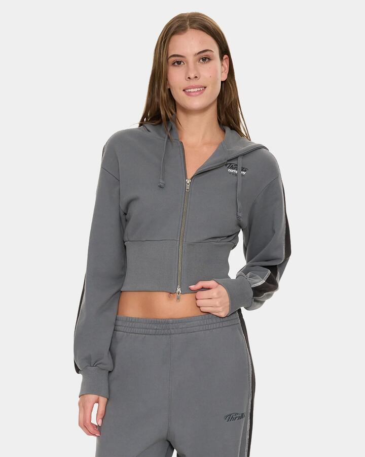 Image of a model wearing Outerwear. Product name - Thrills Division 011 Zip Hood Fleece P62 Petrol in Petrol colour by brand - Thrills