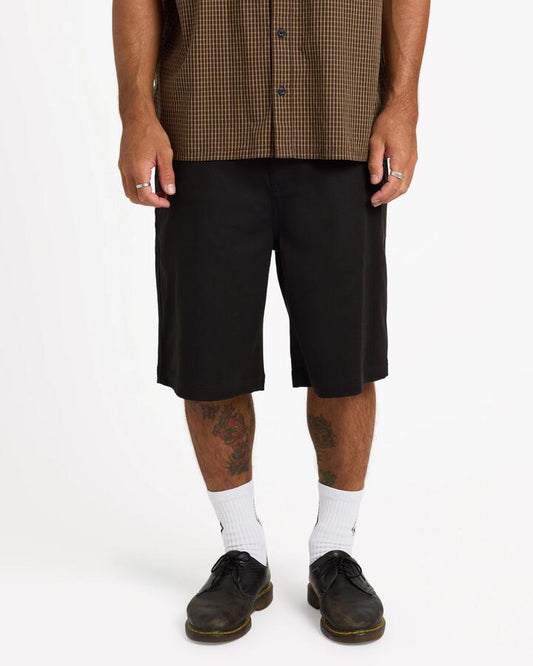 Image of a model wearing Shorts. Product name - Volcom Mens Billow 22" Chino Shorts Black in Black colour by brand - Volcom