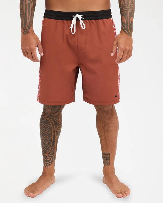 Image of a model wearing Shorts. Product name - Quiksilver Mens Tai Kehu Arch 18" Volley Shorts Henna in Henna colour by brand - Quiksilver