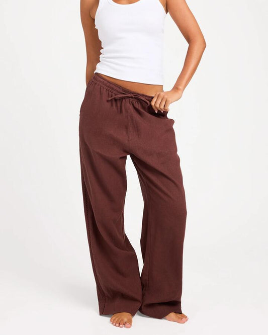 Image of a model wearing Pants. Product name - Roxy Womens Sun Lover Elastic Waist Pants Java in Java colour by brand - Roxy