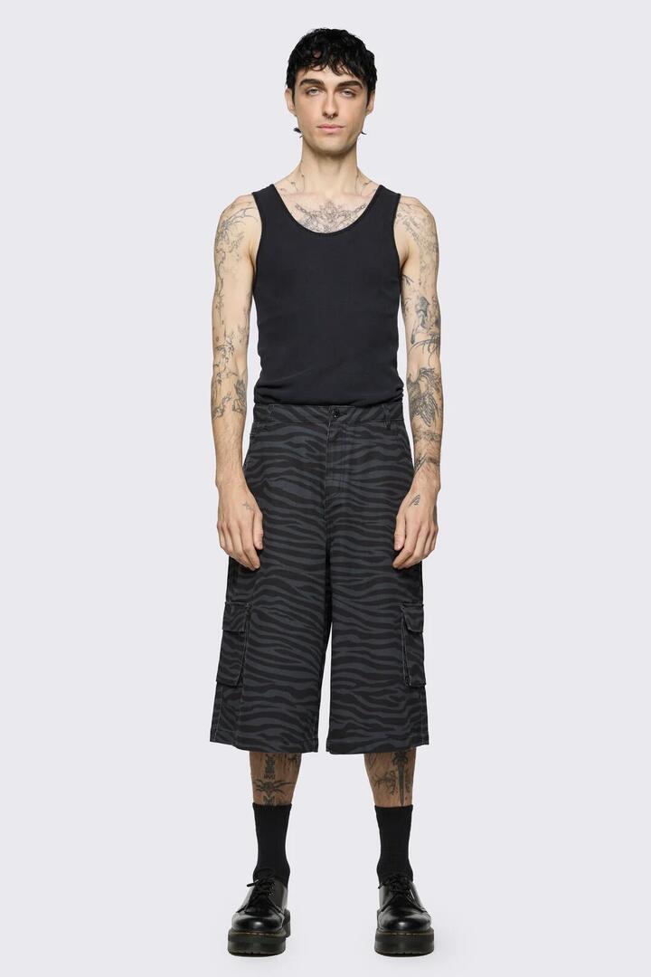 Image of a model wearing Shorts. Product name - Untamed Jorts in Grey colour by brand - Dangerfield