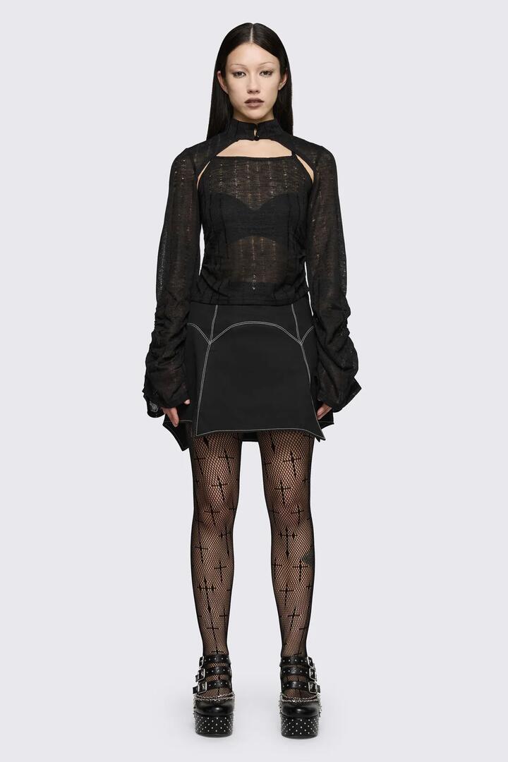 Image of a model wearing Tops. Product name - Minister Knit Sleeve Tank in Black colour by brand - Black Friday