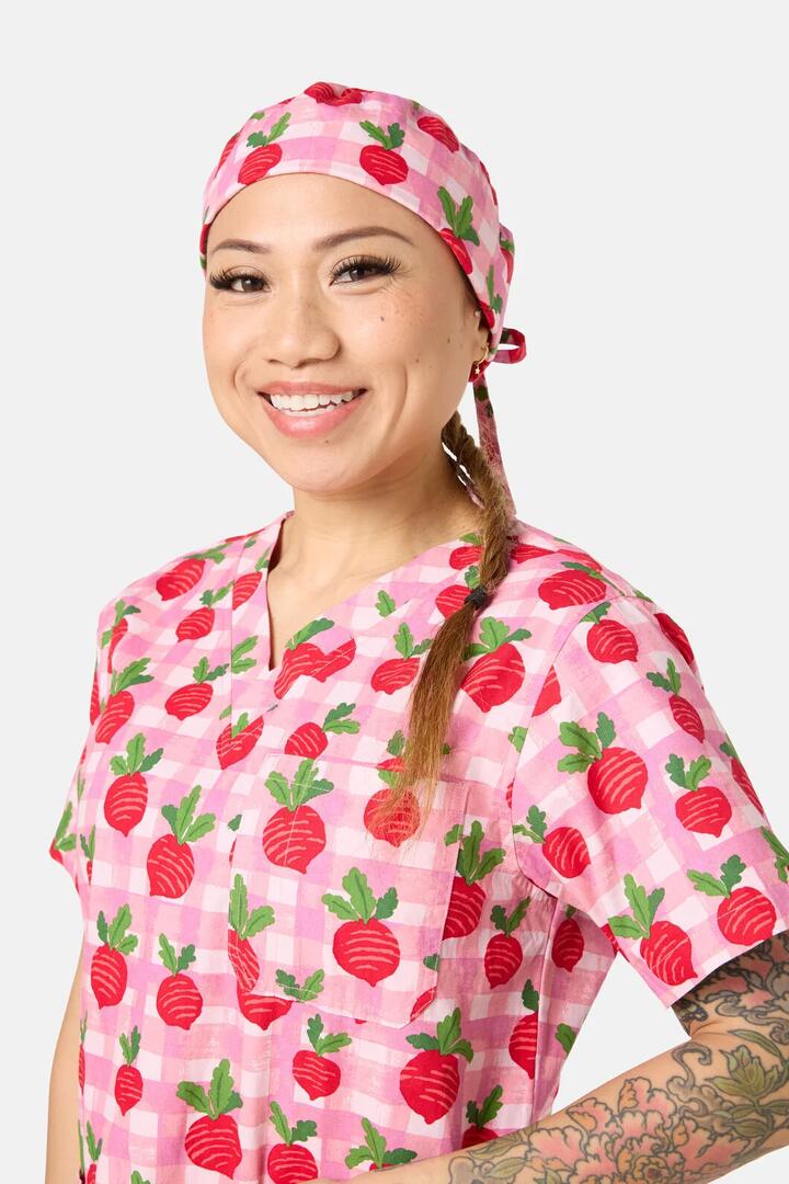 Image of a model wearing Uniforms & Workwear. Product name - Radish Scrub Hat in Pink colour by brand - Scrubs With Love