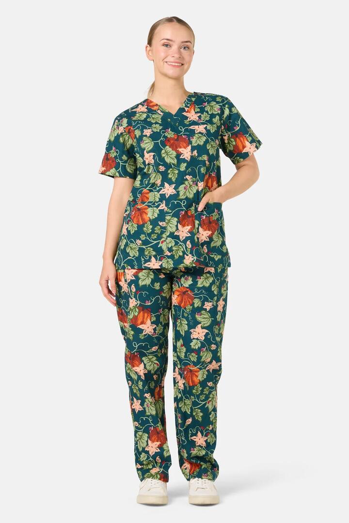 Image of a model wearing Uniforms & Workwear. Product name - Pumpkin Scrub Set in Teal colour by brand - Scrubs With Love