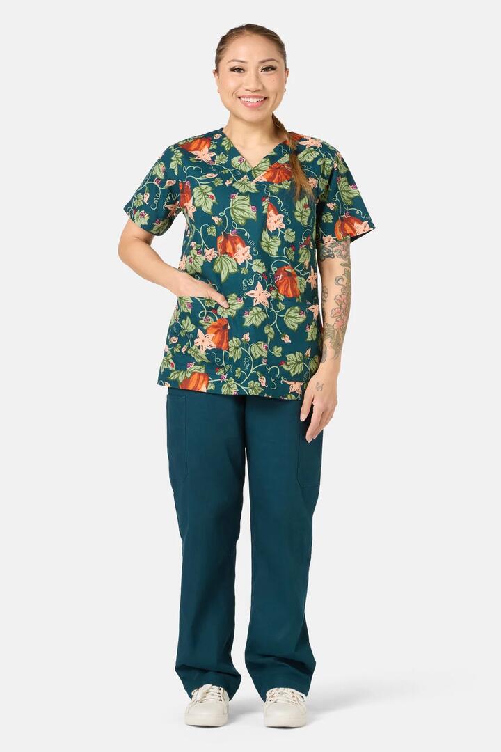 Image of a model wearing Uniforms & Workwear. Product name - Pumpkin Mixed Scrub Set in Teal colour by brand - Scrubs With Love