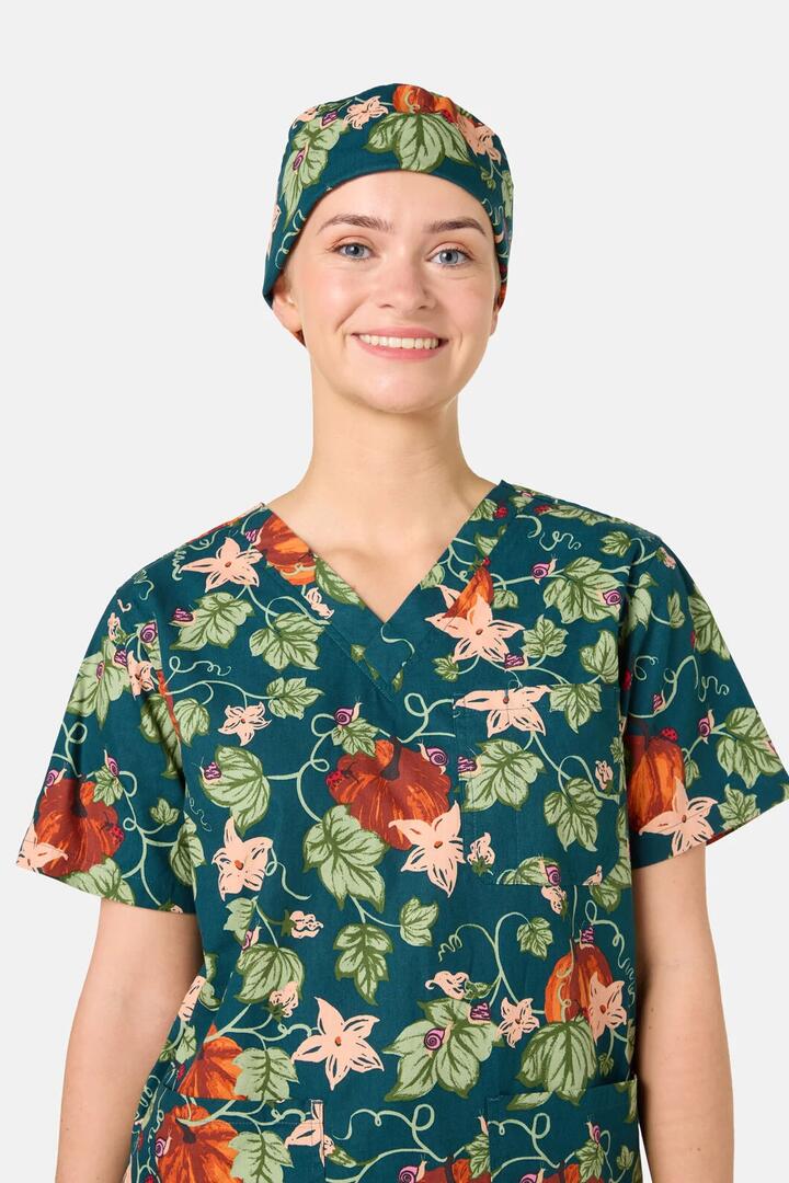 Image of a model wearing Uniforms & Workwear. Product name - Pumpkin Scrub Hat in Teal colour by brand - Scrubs With Love