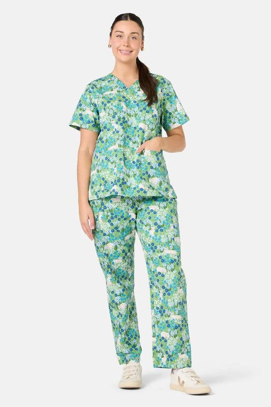 Image of a model wearing Uniforms & Workwear. Product name - Flower Cats Scrub Set in Green colour by brand - Scrubs With Love