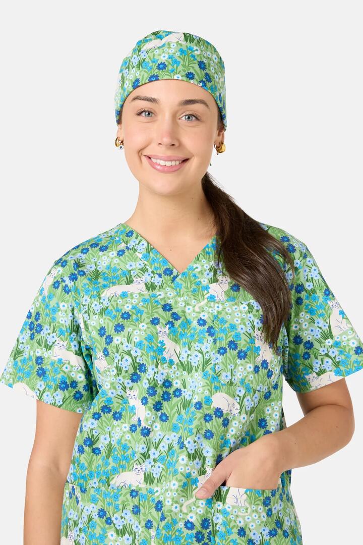 Image of a model wearing Uniforms & Workwear. Product name - Flower Cats Scrub Hat in Green colour by brand - Scrubs With Love