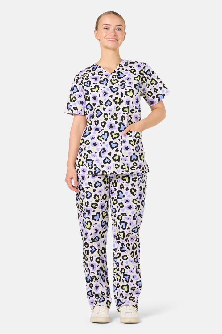 Image of a model wearing Uniforms & Workwear. Product name - Leopard Love Scrub Set in Lilac colour by brand - Scrubs With Love