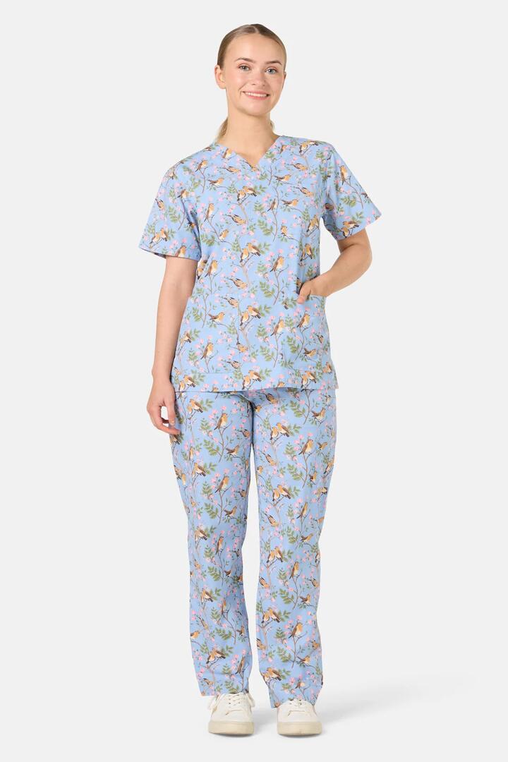 Image of a model wearing Uniforms & Workwear. Product name - Robin Scrub Set in Light Blue colour by brand - Scrubs With Love