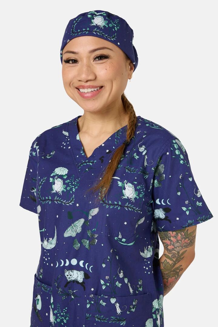 Image of a model wearing Uniforms & Workwear. Product name - Nocturnal Scrub Hat in Navy colour by brand - Scrubs With Love