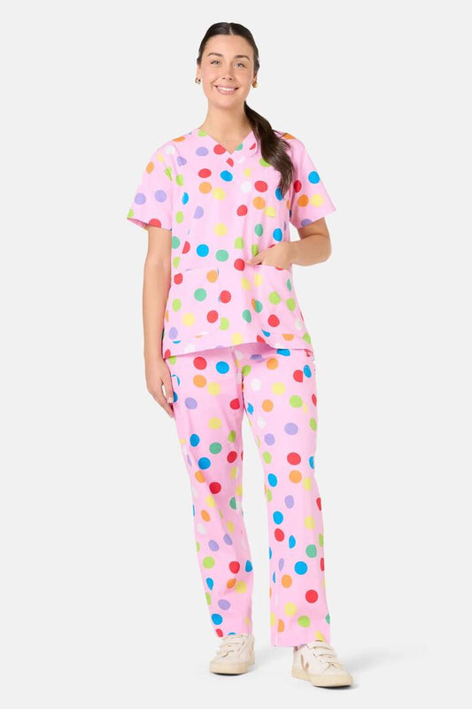 Image of a model wearing Uniforms & Workwear. Product name - Confetti Scrub Set in Pink colour by brand - Scrubs With Love