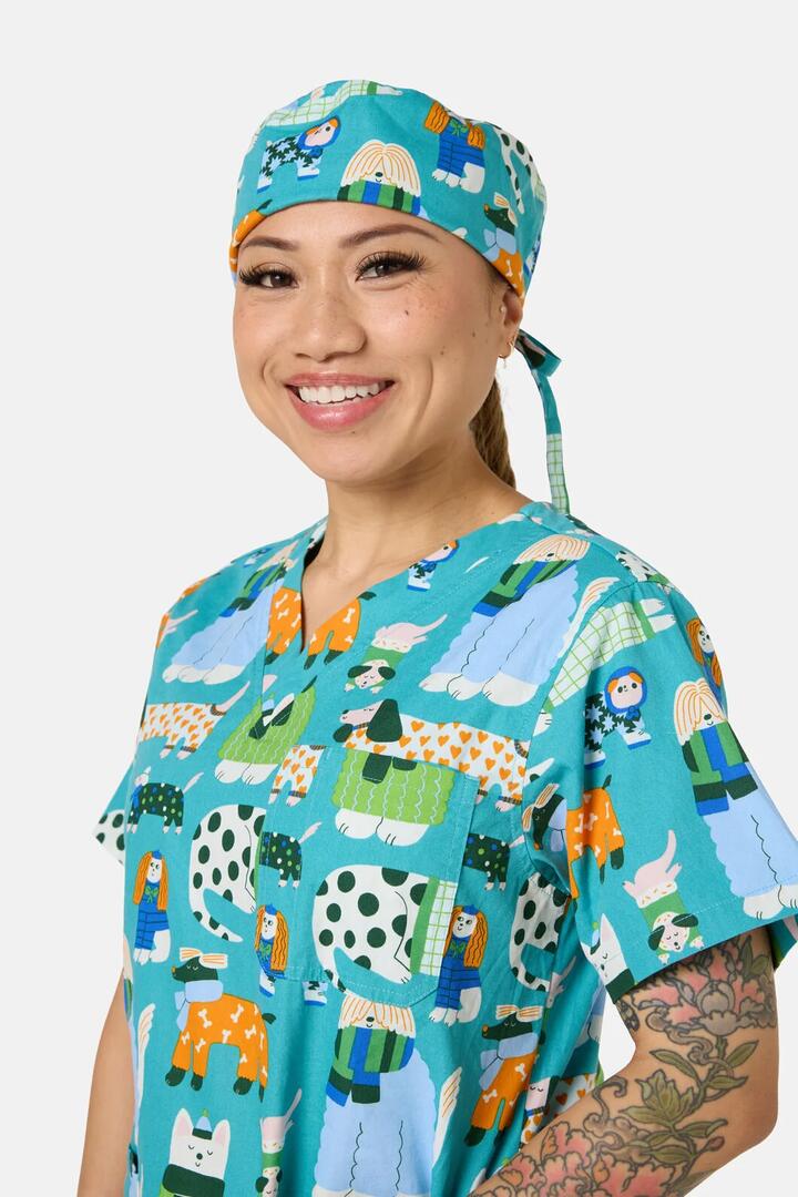 Image of a model wearing Uniforms & Workwear. Product name - Sweater Dogs Scrub Hat in Multi colour by brand - Gorman