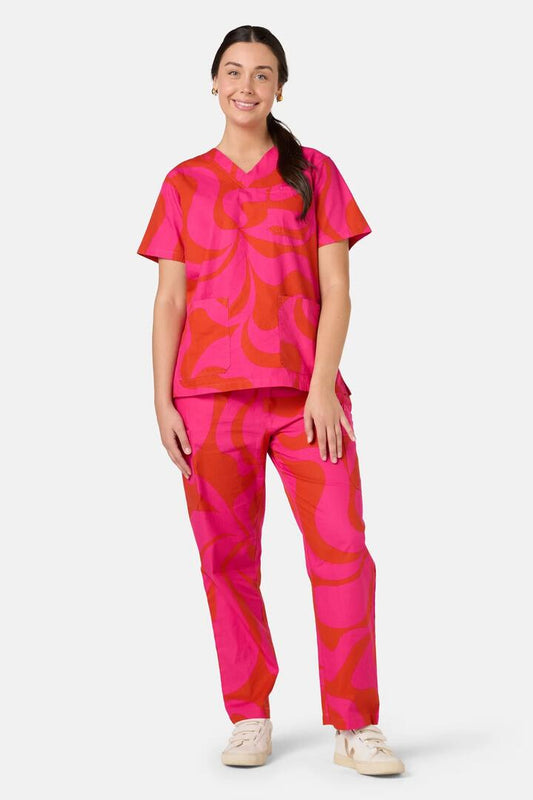 Image of a model wearing Uniforms & Workwear. Product name - Wavelength Scrub Set in Pink colour by brand - Gorman