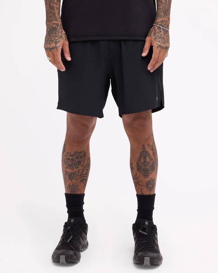 Image of a model wearing Shorts. Product name - Rvca Mens Yogger 2 In1 17" Train Shorts Black in Black colour by brand - Rvca