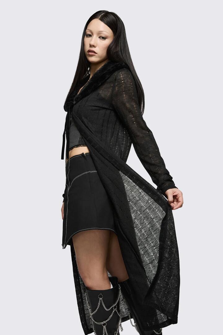 Image of a model wearing Tops. Product name - Minister Knit Cloak in Black colour by brand - Black Friday