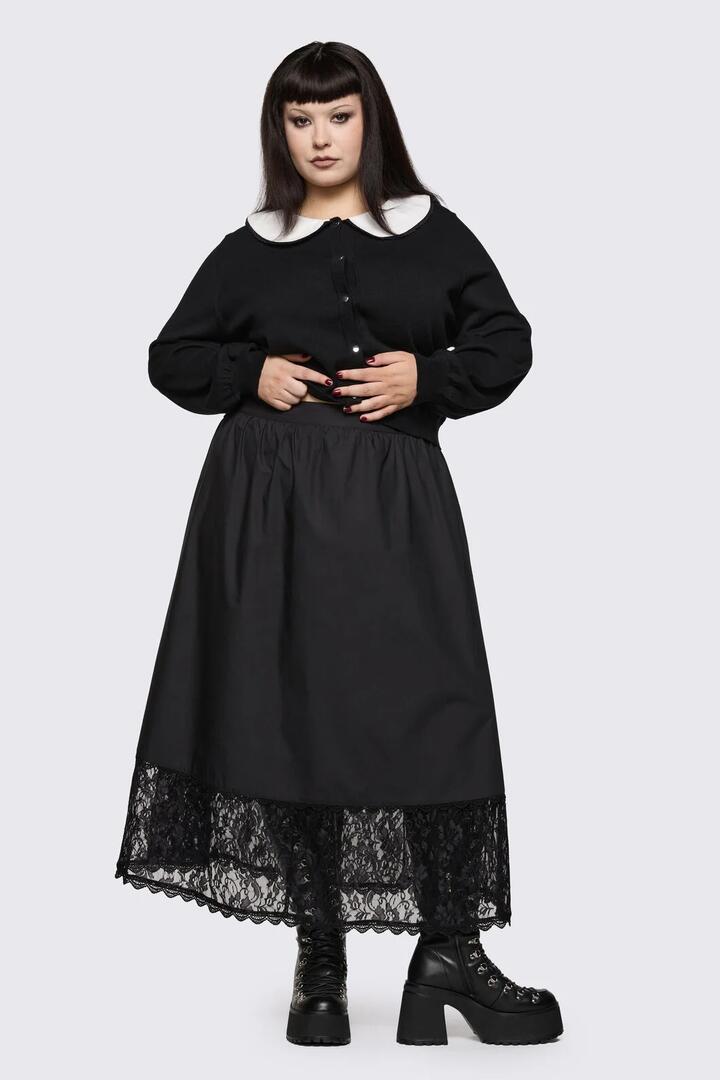 Image of a model wearing Skirts. Product name - Curve Spectre Midi Skirt in Black colour by brand - Dangerfield