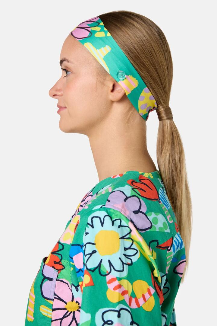 Image of a model wearing Uniforms & Workwear. Product name - Floral Pop Scrub Headband in Green colour by brand - Gorman