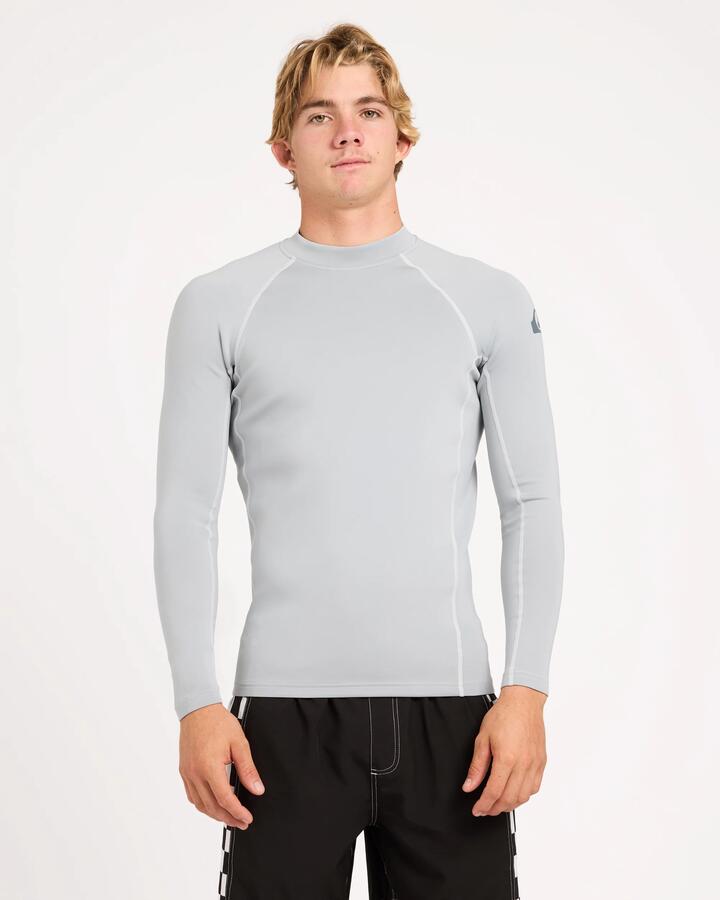 Image of a model wearing Tops. Product name - Quiksilver Mens Everyday Heat Long Sleeve Rash Vest Quarry in Quarry colour by brand - Quiksilver