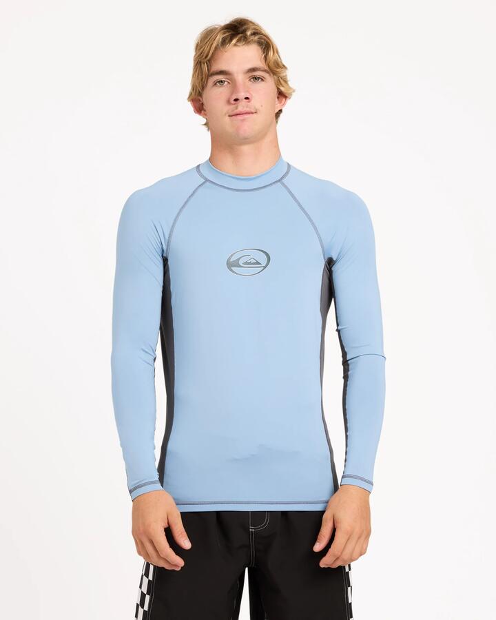 Image of a model wearing Tops. Product name - Quiksilver Mens Core Long Sleeve Surf Shirt Faded Denim in Faded Denim colour by brand - Quiksilver