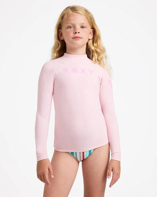 Image of a model wearing Tops. Product name - Roxy Girls 8-16 Girl Heater Upf 50 Long Sleeve Rashguard Rose Shadow in Rose Shadow colour by brand - Roxy