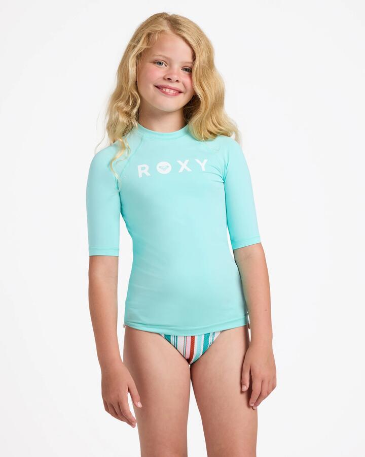 Image of a model wearing Tops. Product name - Roxy Girls 8-16 Essential Upf 50 Short Sleeve Rashguard Aruba Blue in Aruba Blue colour by brand - Roxy