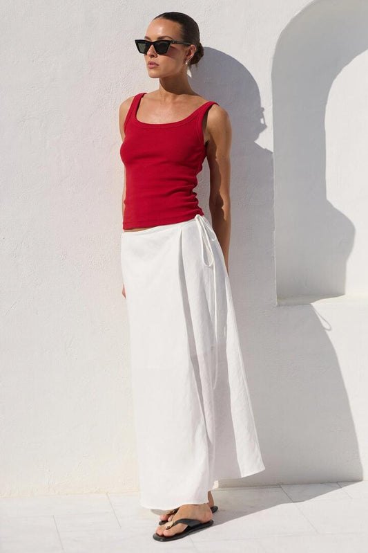 Image of a model wearing Skirts. Product name - Sail White Linen Wrap Bias Maxi Skirt in White colour by brand - RE:UNION Label