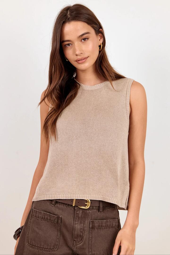 Image of a model wearing Outerwear. Product name - Salute Sand Relaxed Sleeveless Knit Tank Top in Sand colour by brand - Among the Brave