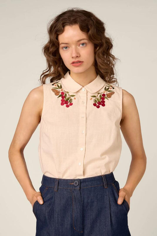 Image of a model wearing Tops. Product name - Orchard Embroidered Top in Cream colour by brand - Princess Highway