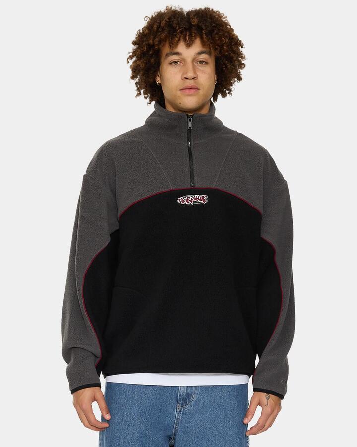 Image of a model wearing Outerwear. Product name - Worship Mens Wyldstyle Quarter Zip Sherpa Fleece Jumper Black in Black colour by brand - Worship