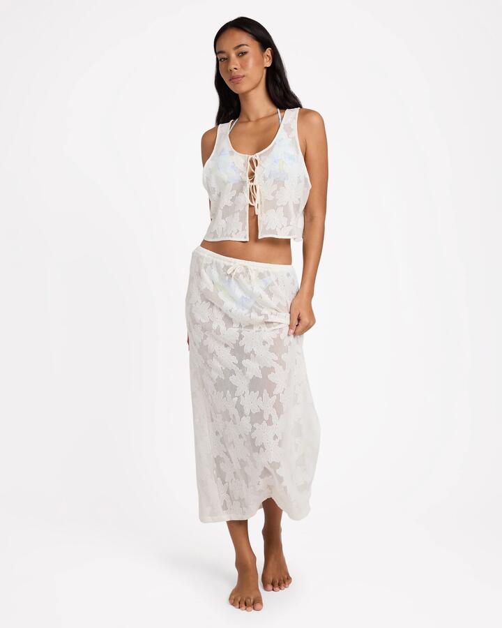 Image of a model wearing Skirts. Product name - Billabong Womens Salt Bloom Lace Midi Skirt Salt Crystal in Salt Crystal colour by brand - Billabong