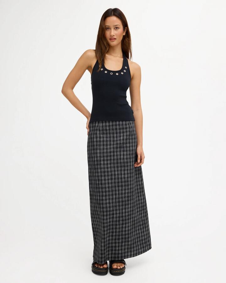 Image of a model wearing Skirts. Product name - Volcom Womens Zephyr Maxi Skirt Asphalt Black in Asphalt Black colour by brand - Volcom