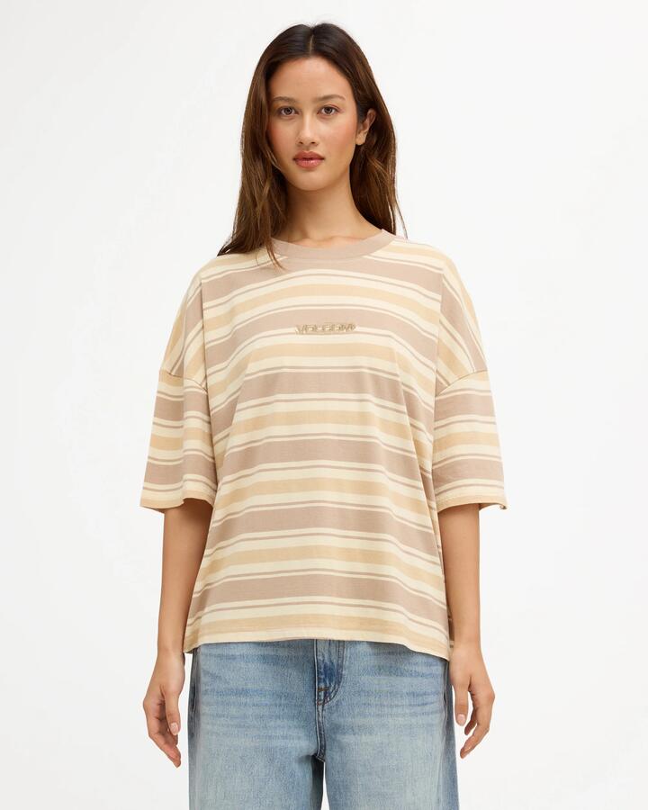Image of a model wearing Tops. Product name - Volcom Womens Triptronic Overized Long Sleeve T-Shirt Sunrise in Sunrise colour by brand - Volcom