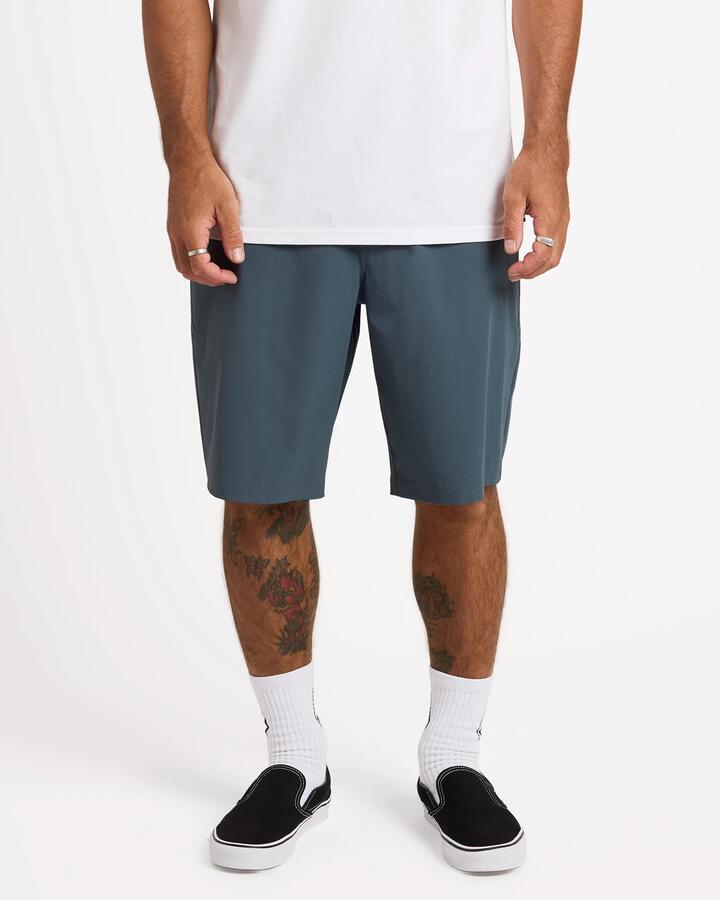 Image of a model wearing Shorts. Product name - Volcom Mens Frickin Cross Shred 20" Hybrid Shorts Dark Slate in Dark Slate colour by brand - Volcom