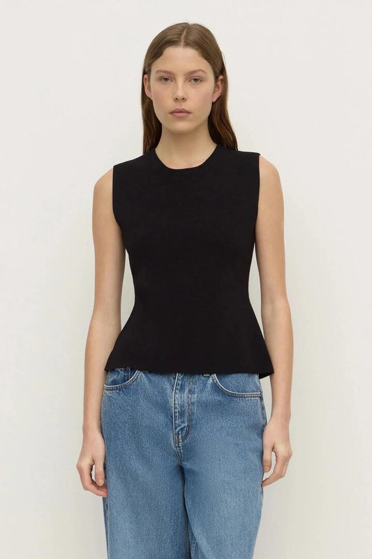 Image of a model wearing Tops. Product name - Evelyn Milano Black Sleeveless Back Tie Knit Top in Black colour by brand - Assembly Label