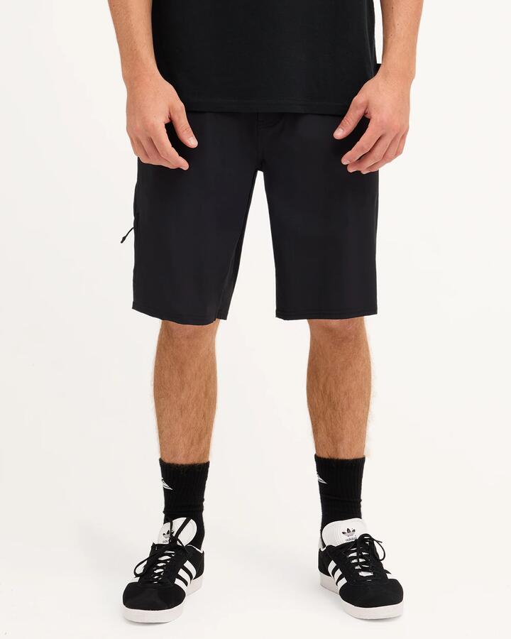 Image of a model wearing Shorts. Product name - Quiksilver Mens Recoil Tech Amphibian 21" Hybrid Shorts Black in Black colour by brand - Quiksilver