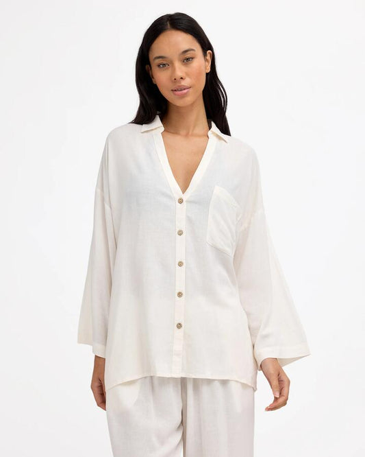 Image of a model wearing Tops. Product name - Billabong Womens Sun Days Long Sleeve Shirt Sea Salt in Sea Salt colour by brand - Billabong