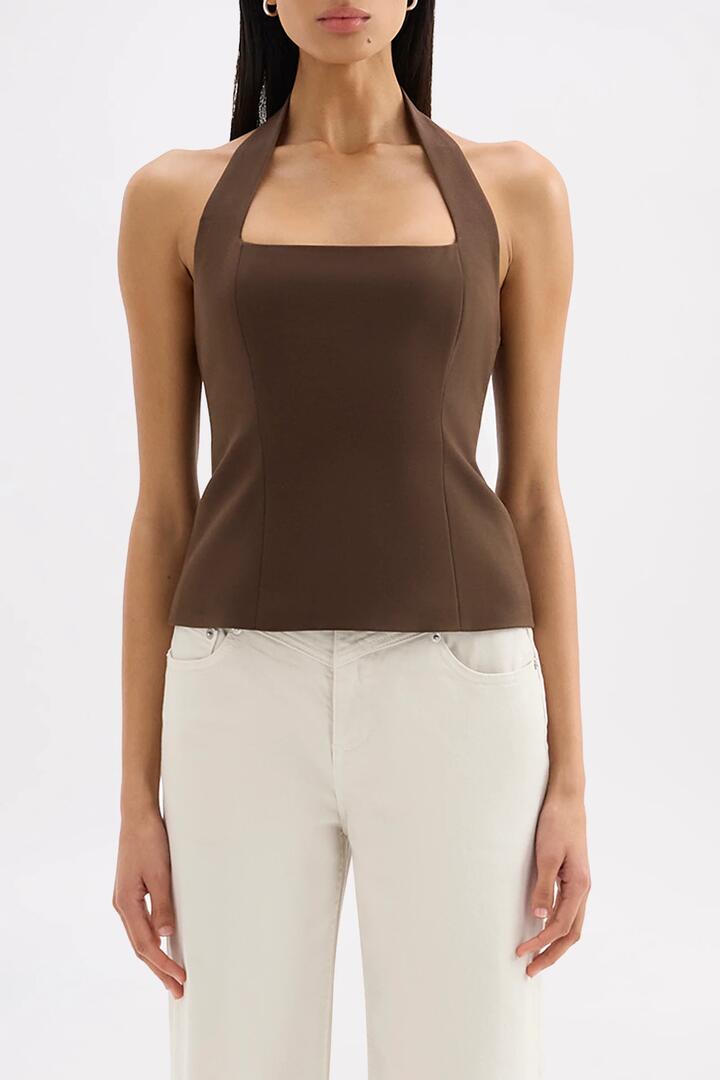 Image of a model wearing Tops. Product name - Myra Chocolate Halter Top in Chocolate colour by brand - Nude Lucy