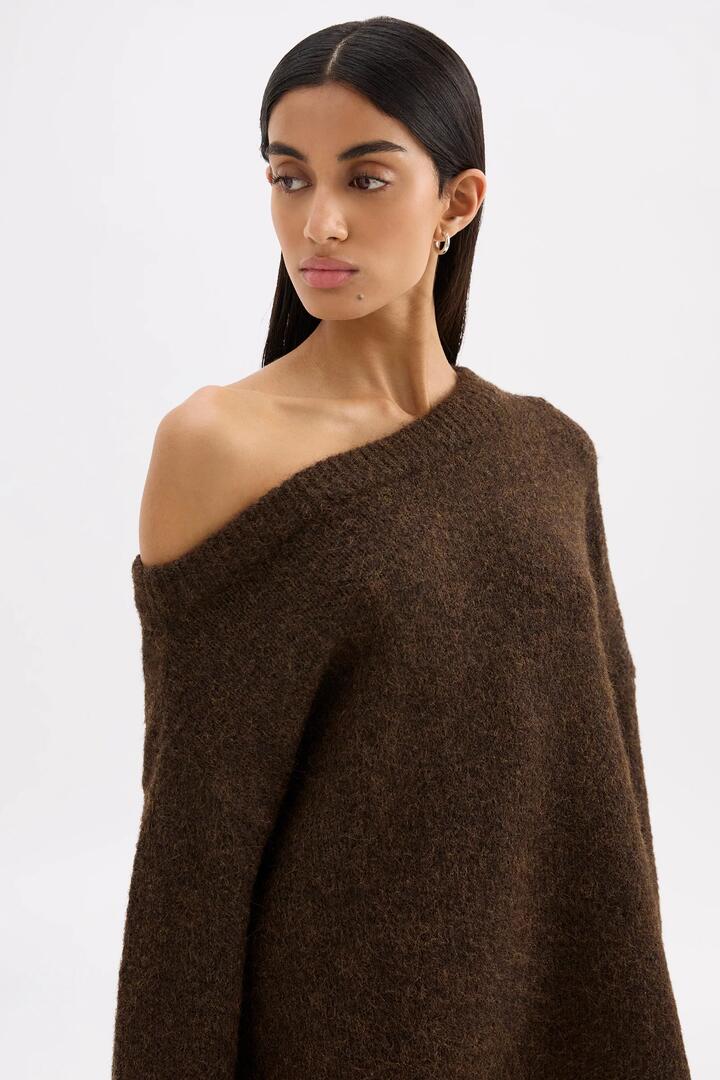 Image of a model wearing Outerwear. Product name - Lavinia Chocolate Off Shoulder Knit in Brown colour by brand - Nude Lucy