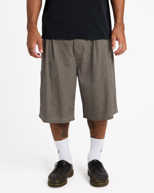 Image of a model wearing Shorts. Product name - Volcom Mens Holter Pleated Walkshorts Cacao in Cacao colour by brand - Volcom