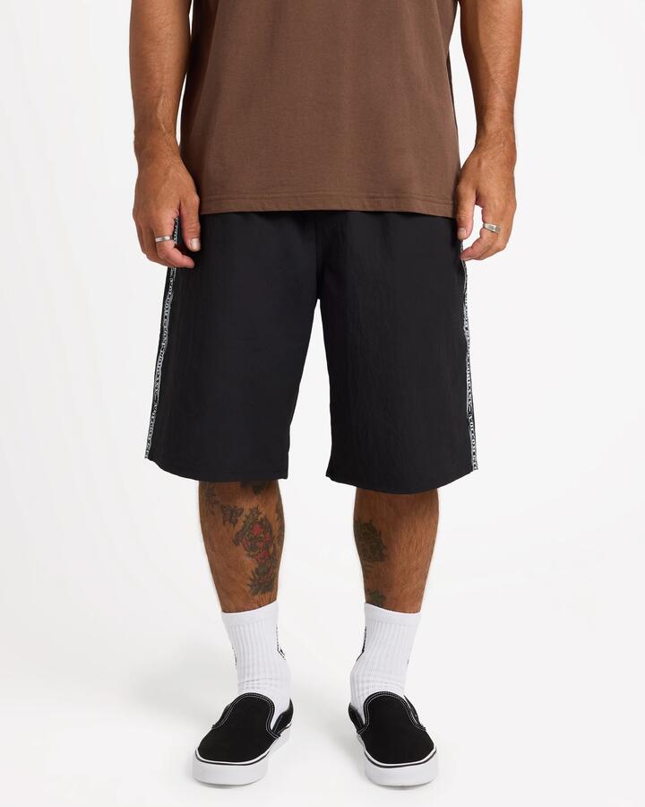 Image of a model wearing Shorts. Product name - Volcom Mens Dispensor Short 22" Shorts Black in Black colour by brand - Volcom