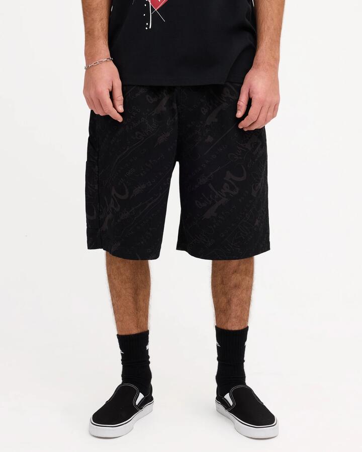Image of a model wearing Shorts. Product name - Quiksilver Mens Illusion 23" Walkshorts Black in Black colour by brand - Quiksilver