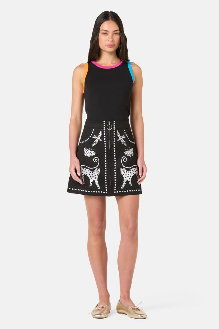 Image of a model wearing Skirts. Product name - Right Meow Embroidered Mini Skirt in Black colour by brand - Gorman