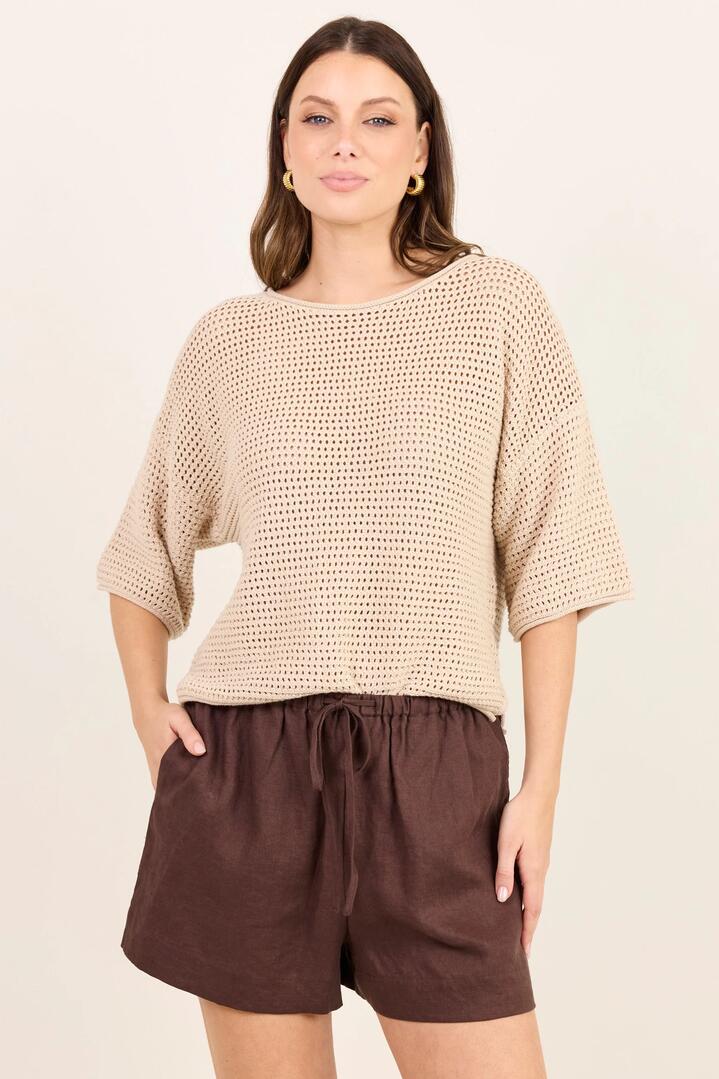 Image of a model wearing Shorts. Product name - Lifestyle Dark Chocolate Linen Tie Waist Shorts in Dark Chocolate colour by brand - RE:UNION Label
