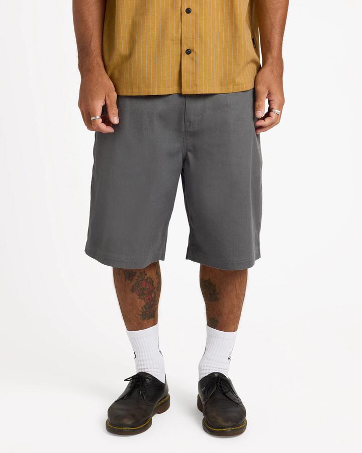 Image of a model wearing Shorts. Product name - Volcom Mens Billow 22" Chino Shorts Pewter in Pewter colour by brand - Volcom