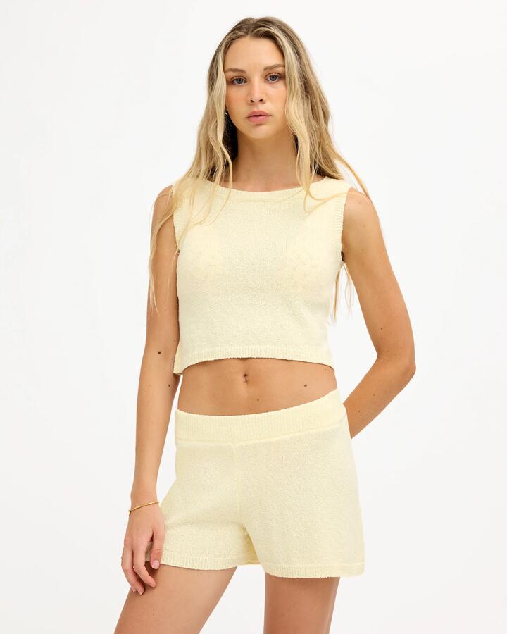 Image of a model wearing Shorts. Product name - Roxy Womens Golden Elastic Waist Shorts Lemon Drop in Lemon Drop colour by brand - Roxy