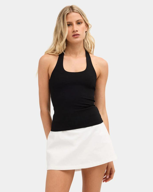 Image of a model wearing Tops. Product name - Nunui Womens Haliday Halter Top Black in Black colour by brand - Nunui