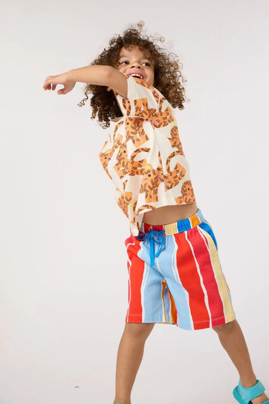 Image of a model wearing Shorts. Product name - Red Stripes Kids Shorts in Red Stripe colour by brand - Gorman